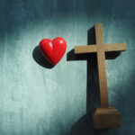 Red,Heart,With,Wood,Crucifix,On,Grey,Marble.,Concept,Jesus